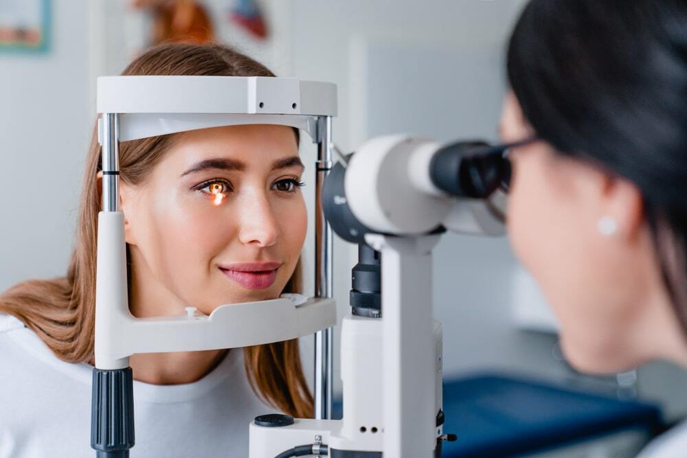 Female at the optometrists office getting an eye exam