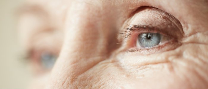 Close up of elderly woman's blue eyes