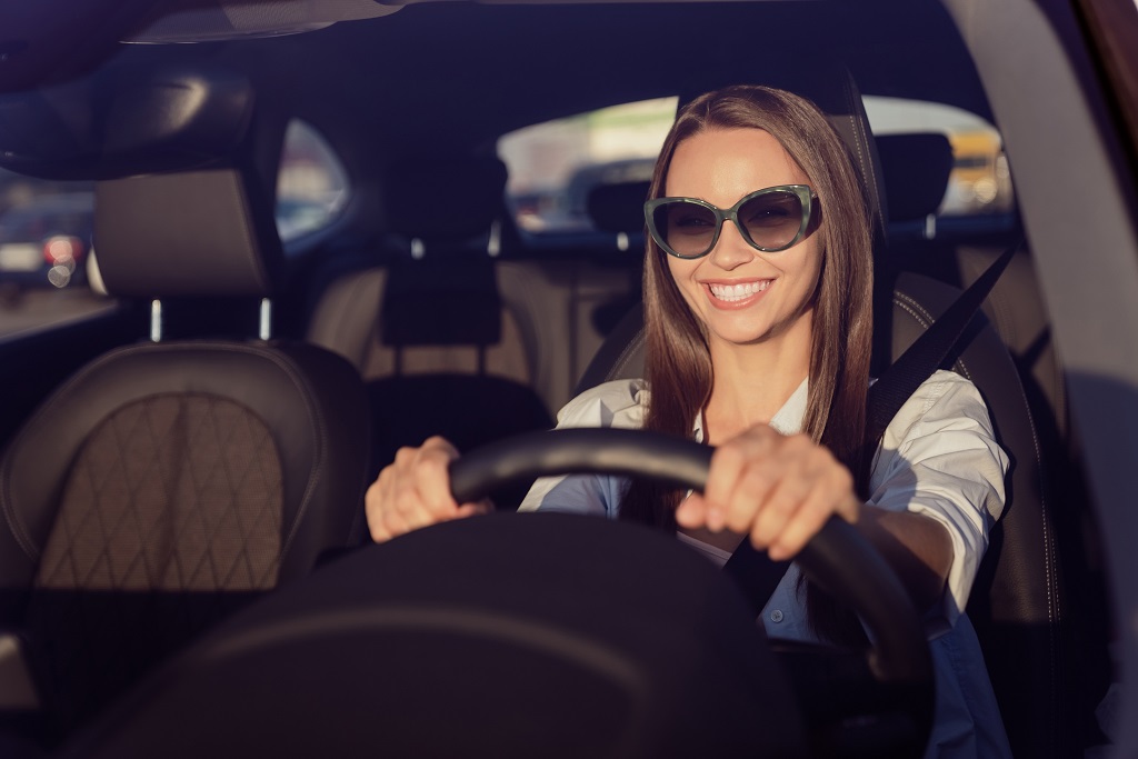 lady driving with sunglasses on after LASIK