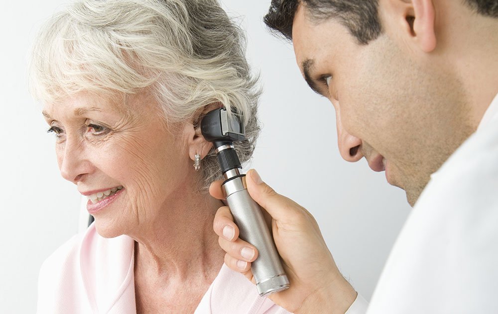 doctor looking in patients ear