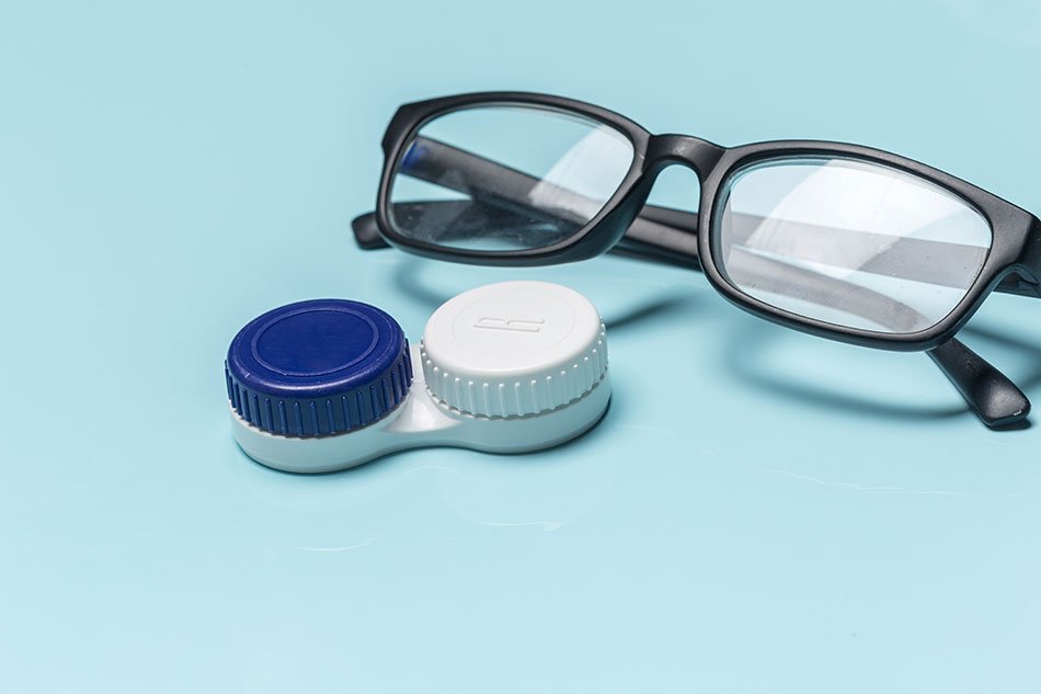 photo of eye glasses and contact lenses case
