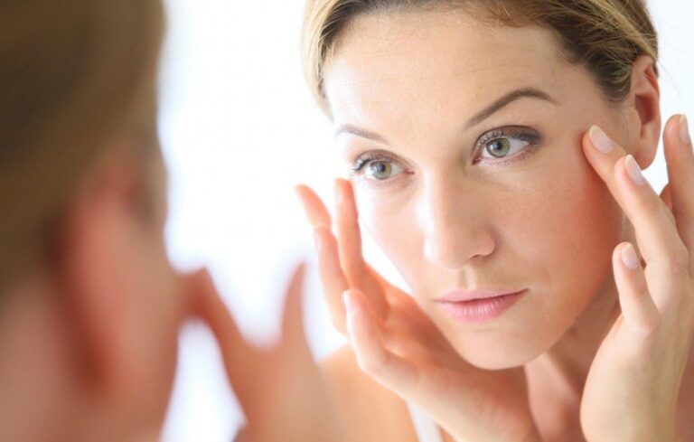 lady looking at herself in the mirror