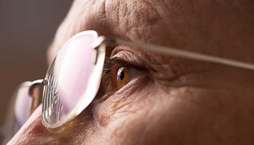 close up image of a man wearing glasses