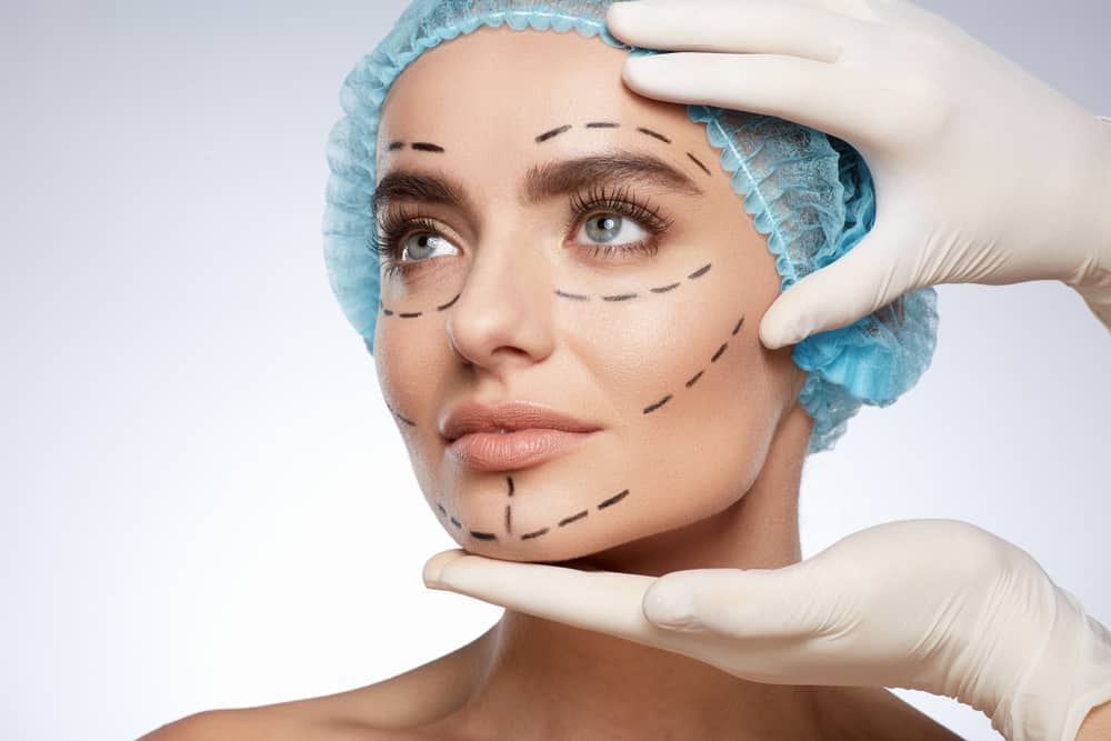Woman's face being examined by doctor