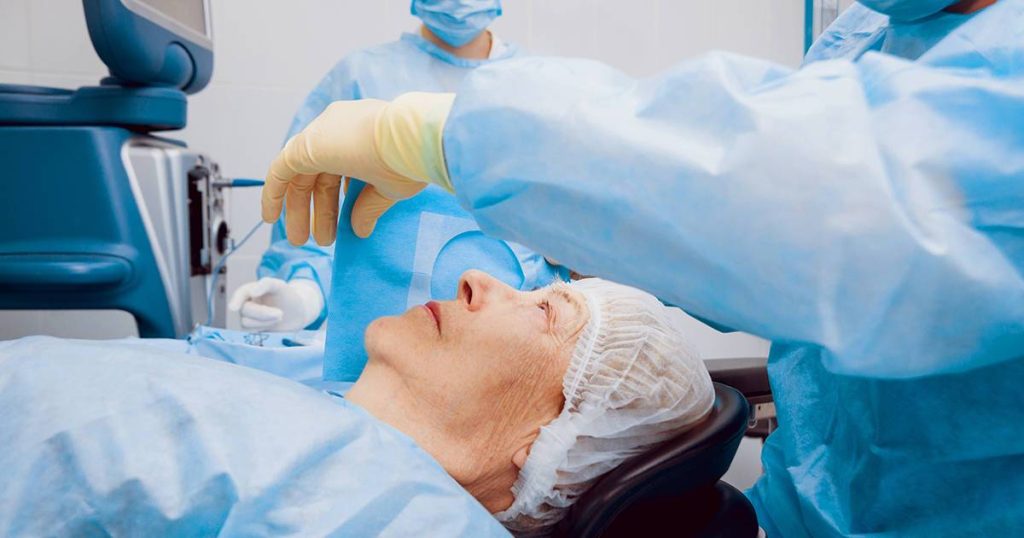 Elderly woman is prepped in the operating room for cataract surgery