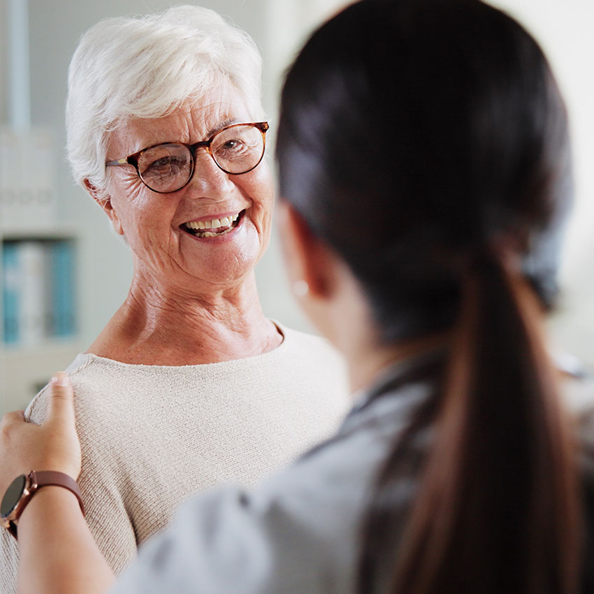 Consulting,-doctor-and-happy-with-old-woman-in-office-for-patient-feedback,-insurance-and-physiotherapy-plan