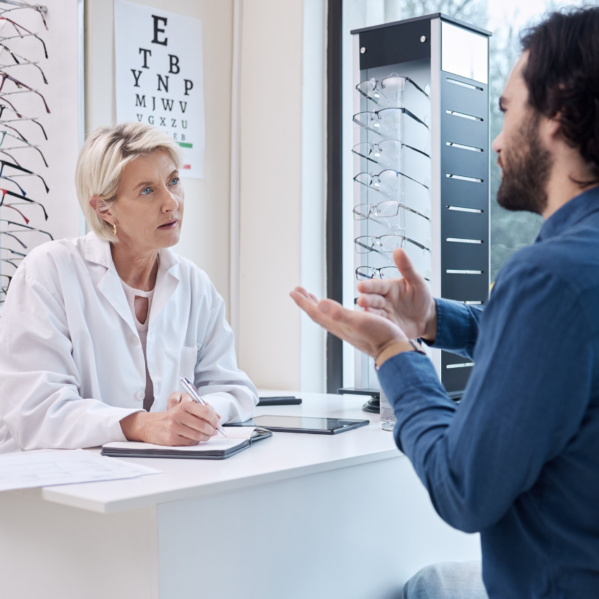 Eye doctor or man consulting for eyesight advice at optometrist