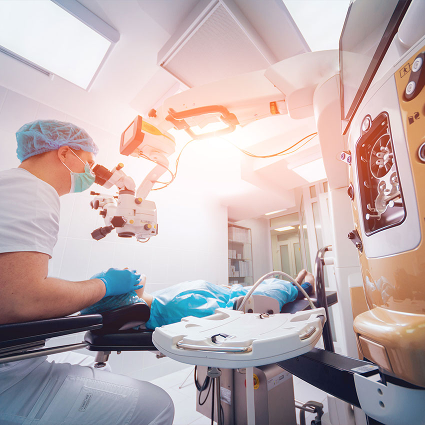 Eye-surgery.-A-patient-and-surgeon-in-the-operating-room-during-ophthalmic-surgery.-Patient-under-surgical-microscope