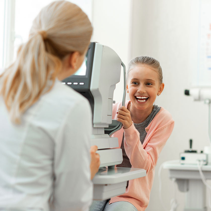 Important-appointment.-Laughing-pretty-girl-with-tied-hair-having-fun-while-visiting-medical-cabinet-and-checking-vision