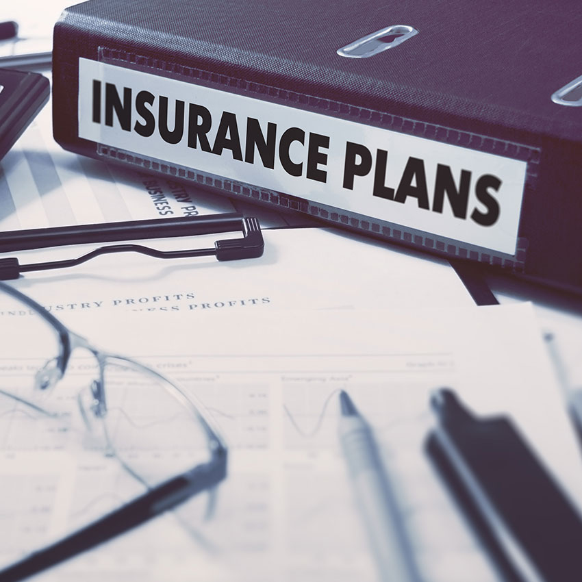 Insurance-Plans---Ring-Binder-on-Office-Desktop-with-Office-Supplies
