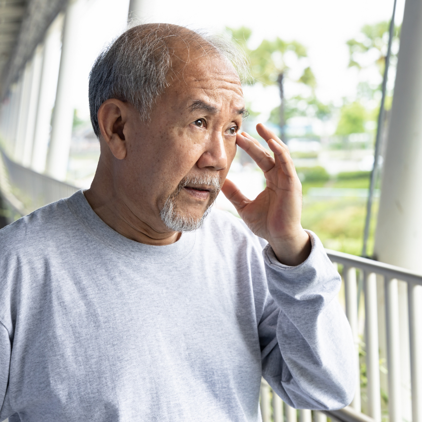 Old senior man having eyesight problem or dry eye symptoms