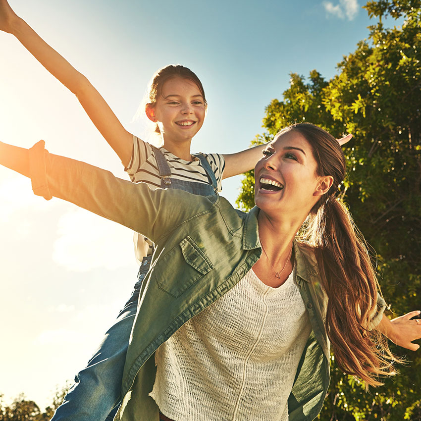 Piggyback, flying and a mother and child in nature for bonding, happiness and love in summer