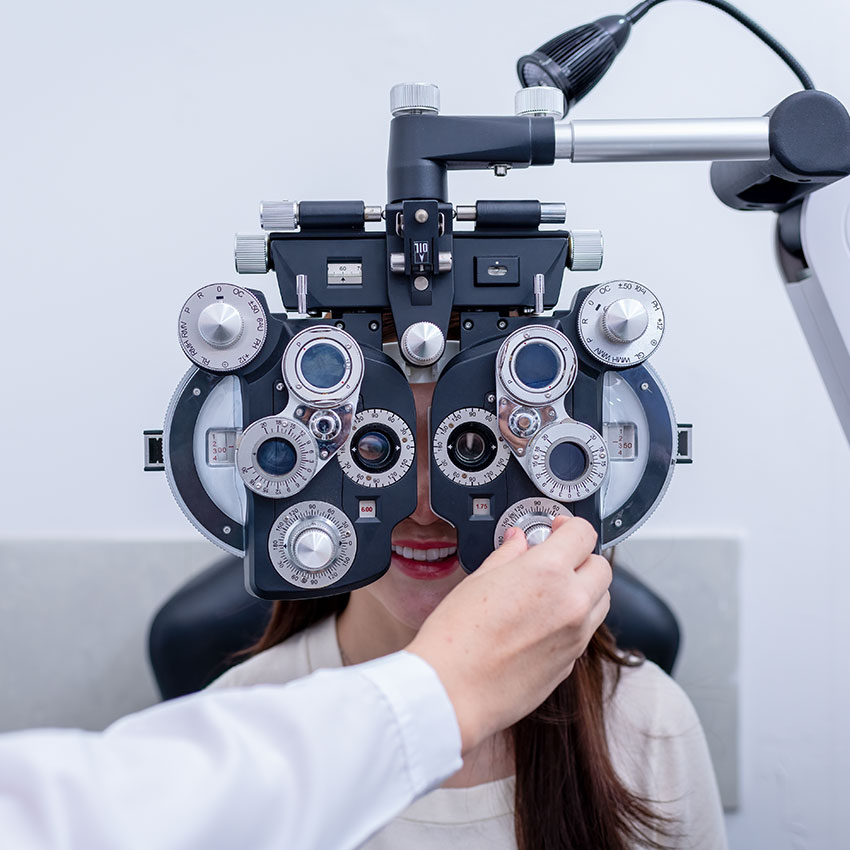 Woman-optical-shop-customer-doing-eyesight-measurement-with-optical-phoropter-check