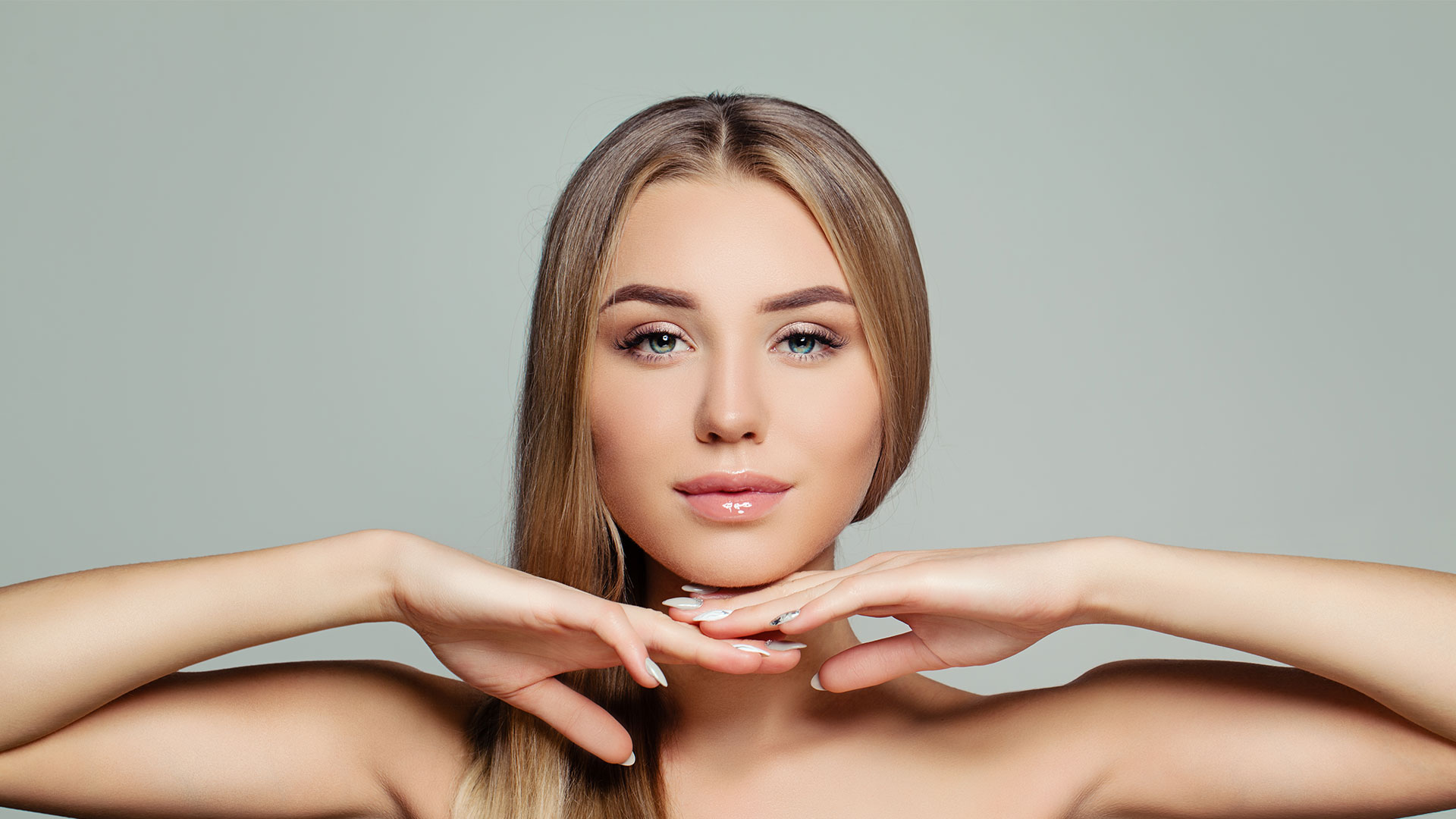 Young-adult-woman-with-long-healthy-straight-hair-and-perfect-clear-skin