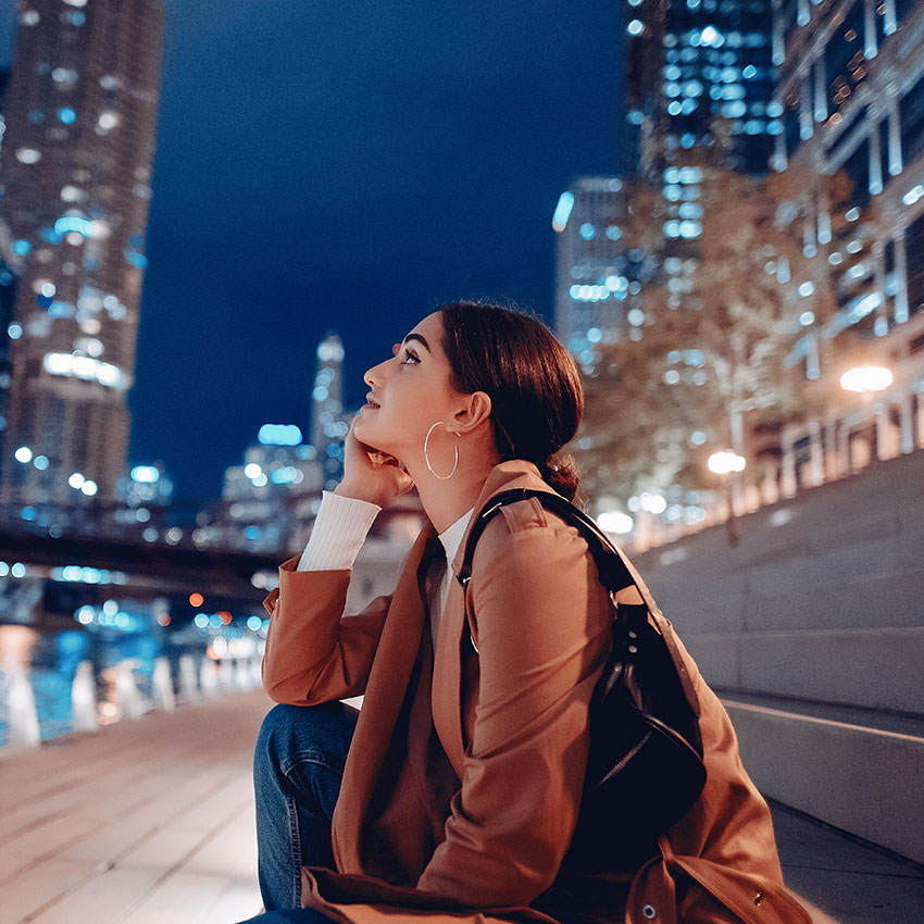 beautiful-young-woman-walking-near-Chicago-river-at-night