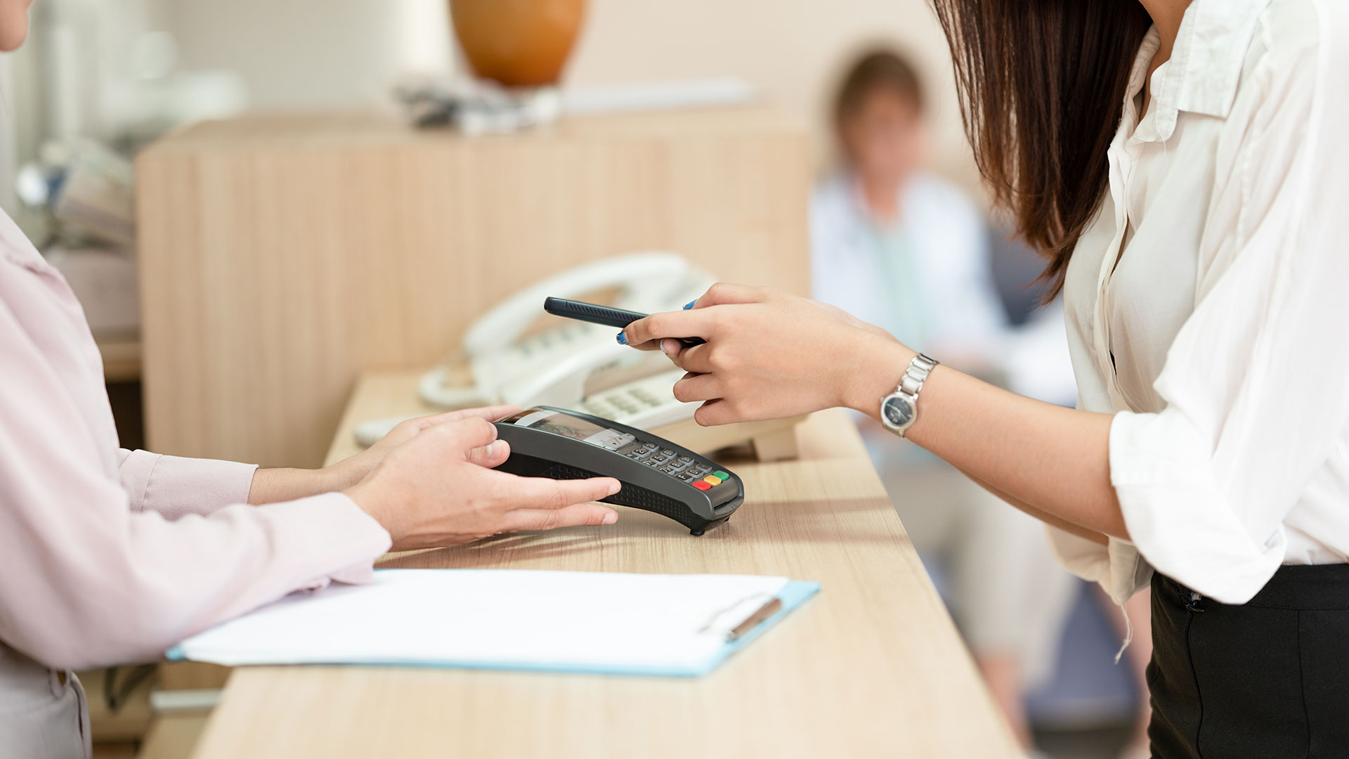 Asian-women-scan-electronic-payment-channels-pay-online-or-a-credit-card-payment-machine.-online-payment-cashless-society