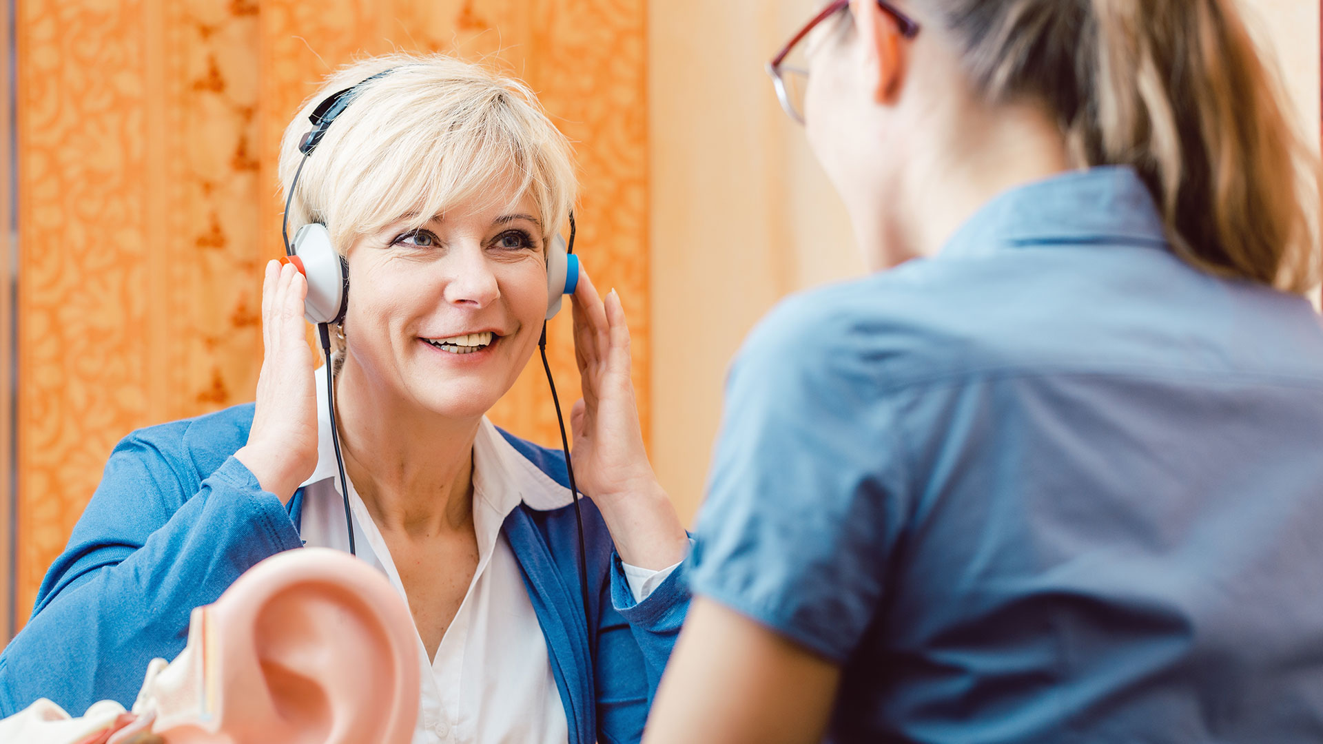 Older-woman-or-female-pensioner-with-a-hearing-problem-takes-test