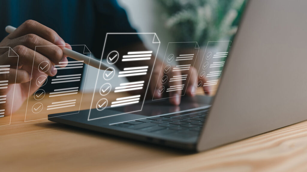 Man using laptop with floating icons