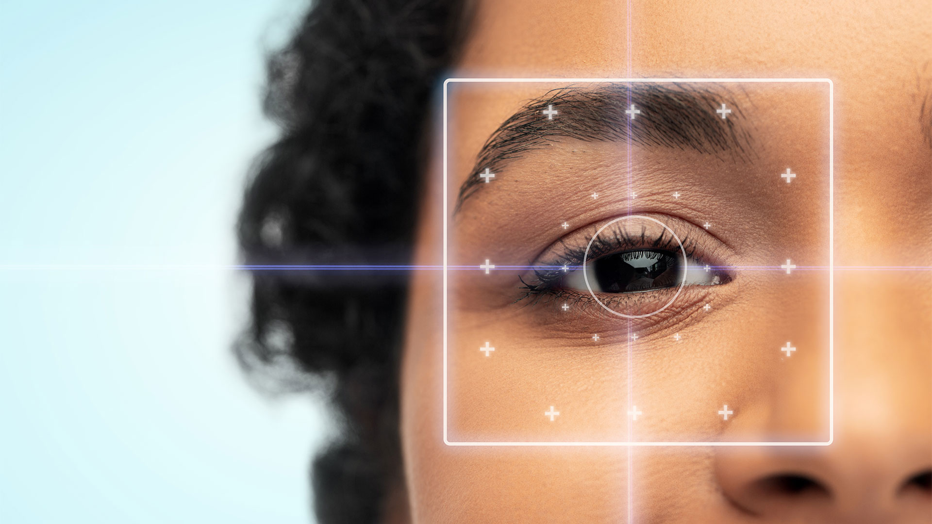 vision-correction,-laser-eye-surgery-and-health-concept---close-up-of-young-african-american-woman-face-over-blue-background