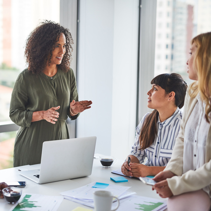 Manager, training and team of business women in meeting, coaching or learning in creative startup. Group, leader and discussion for brainstorming ideas, project update and metrics for event planning