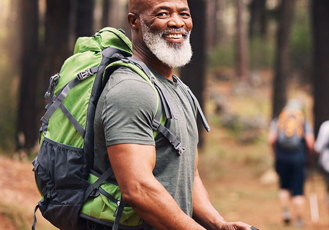 Portrait,-black-man-and-hiking-in-forest,-exercise-and-fitness-for-wellness