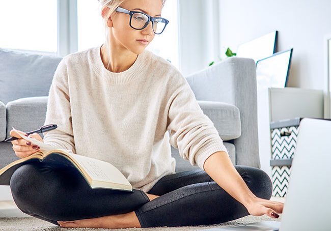 Woman-using-laptop-paying-bills-online-and-managing-home-budget