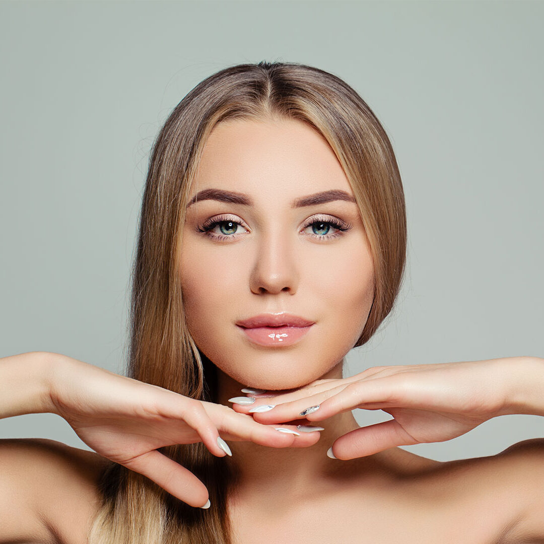 Young-adult-woman-with-long-healthy-straight-hair-and-perfect-clear-skin